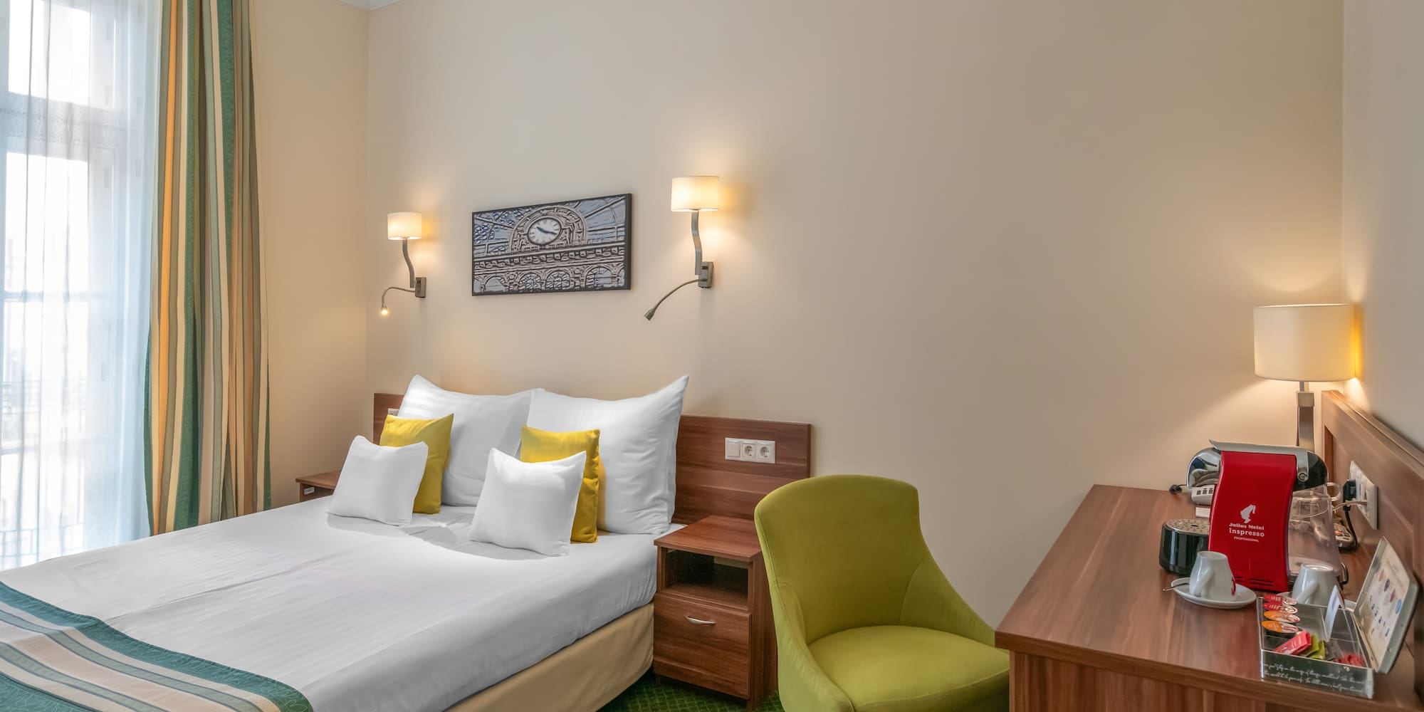 a room with a bed and a desk