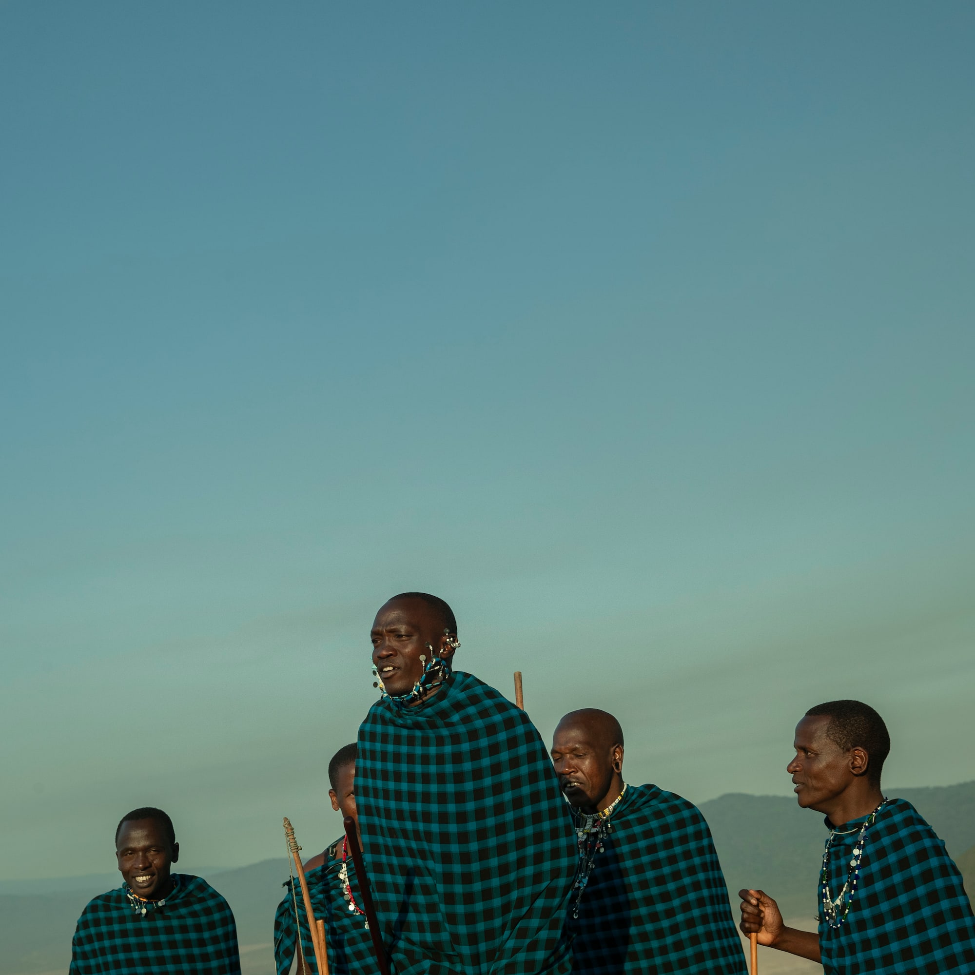 a group of men wearing matching outfits