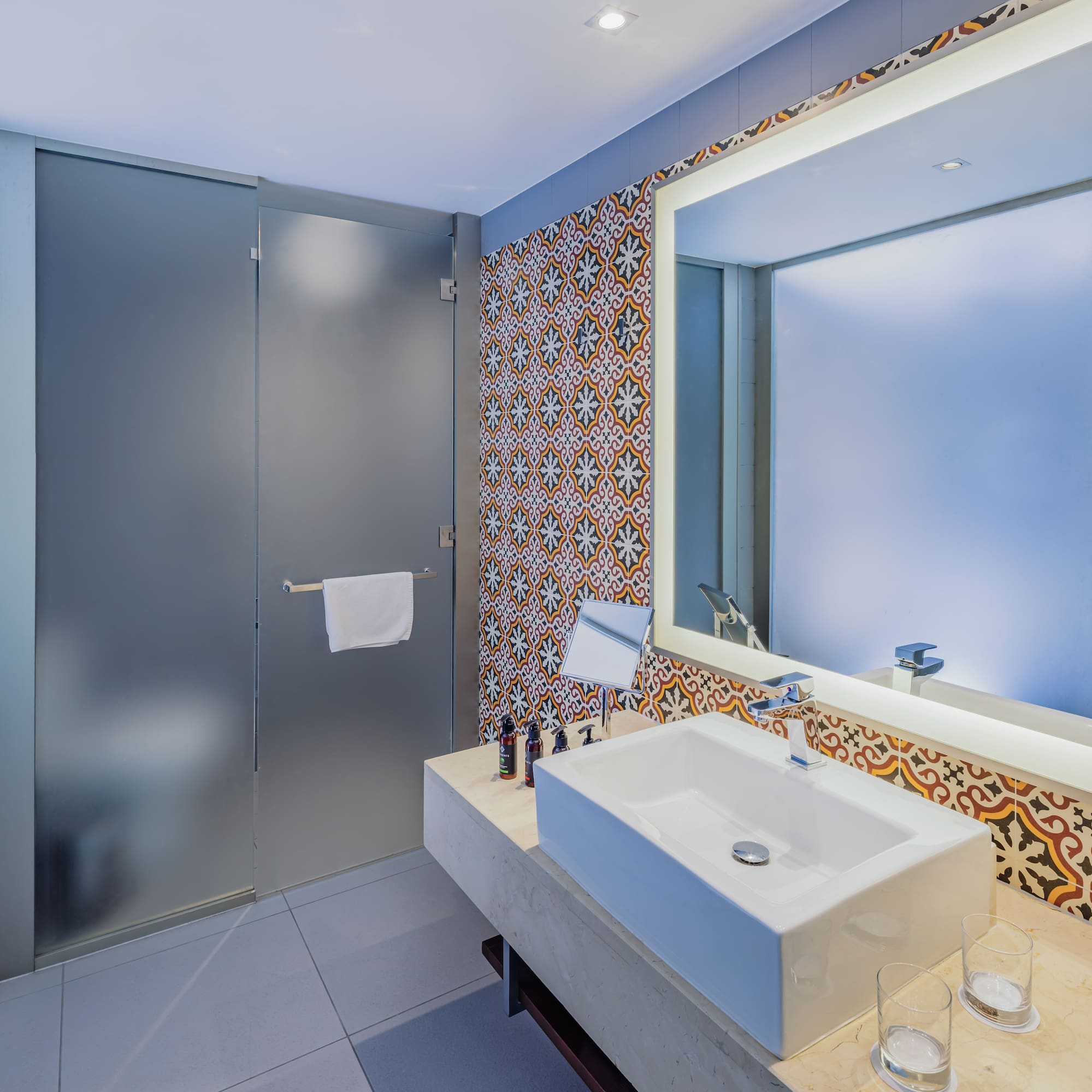 a bathroom with a sink and mirror