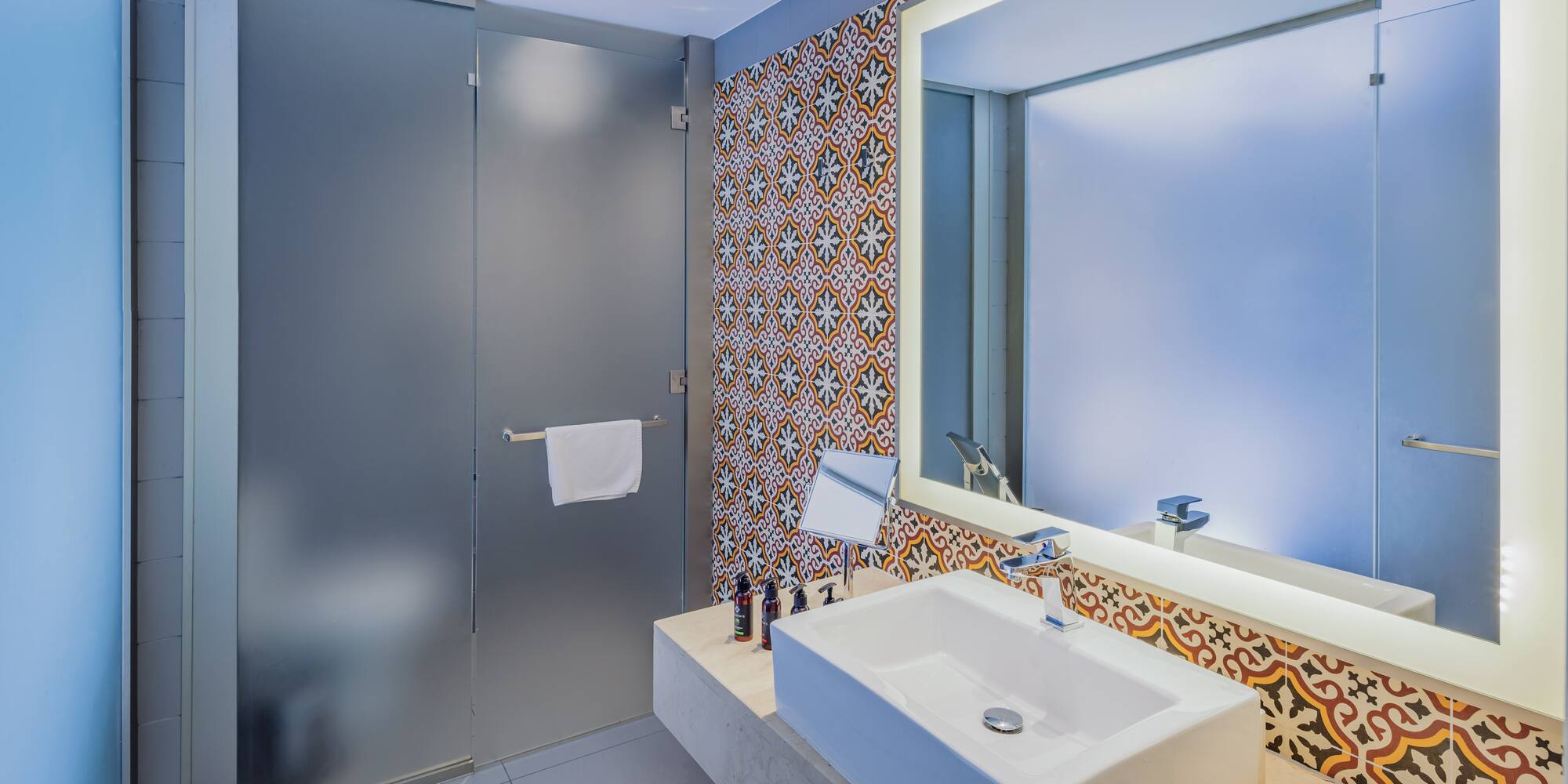 a bathroom with a sink and mirror