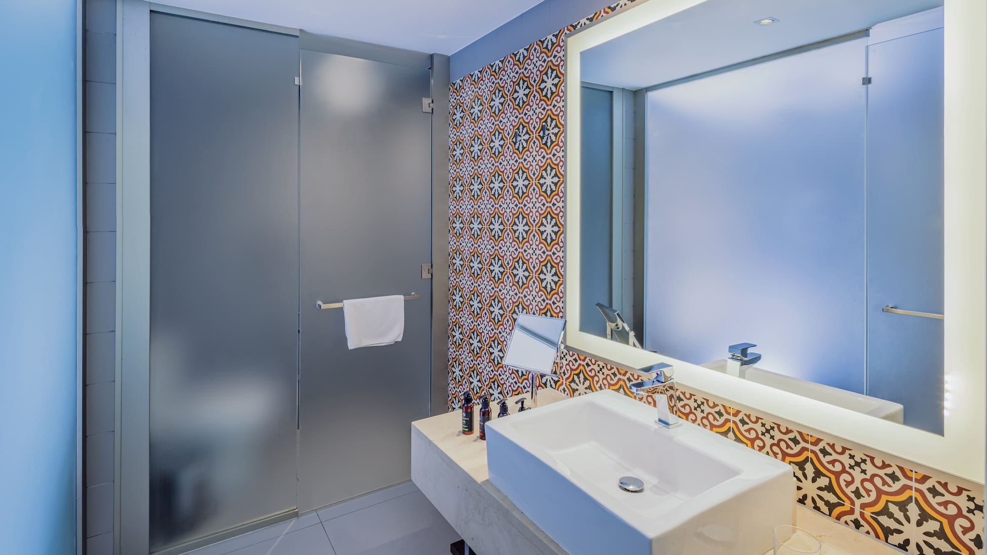 a bathroom with a sink and mirror