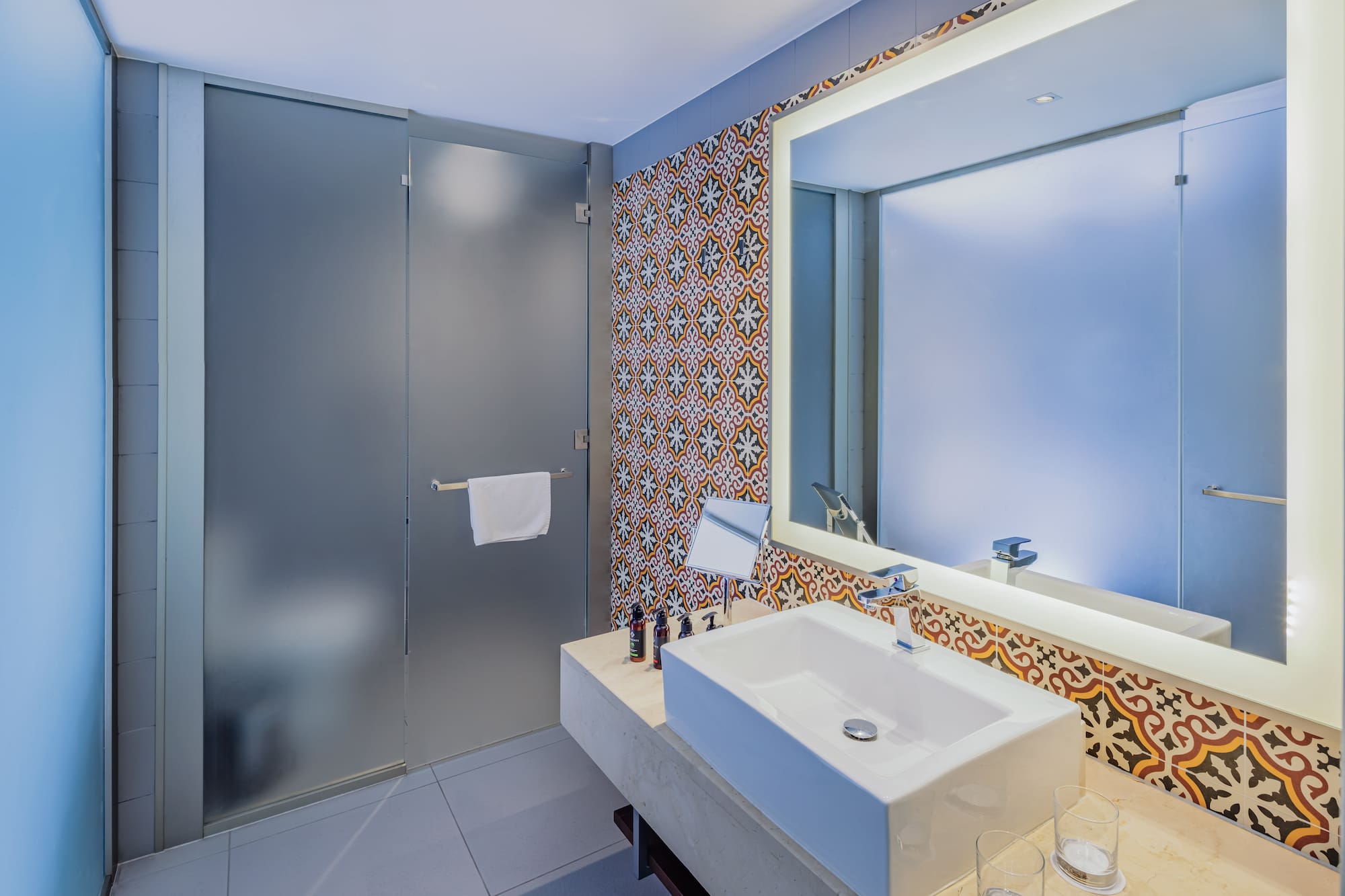 a bathroom with a sink and mirror