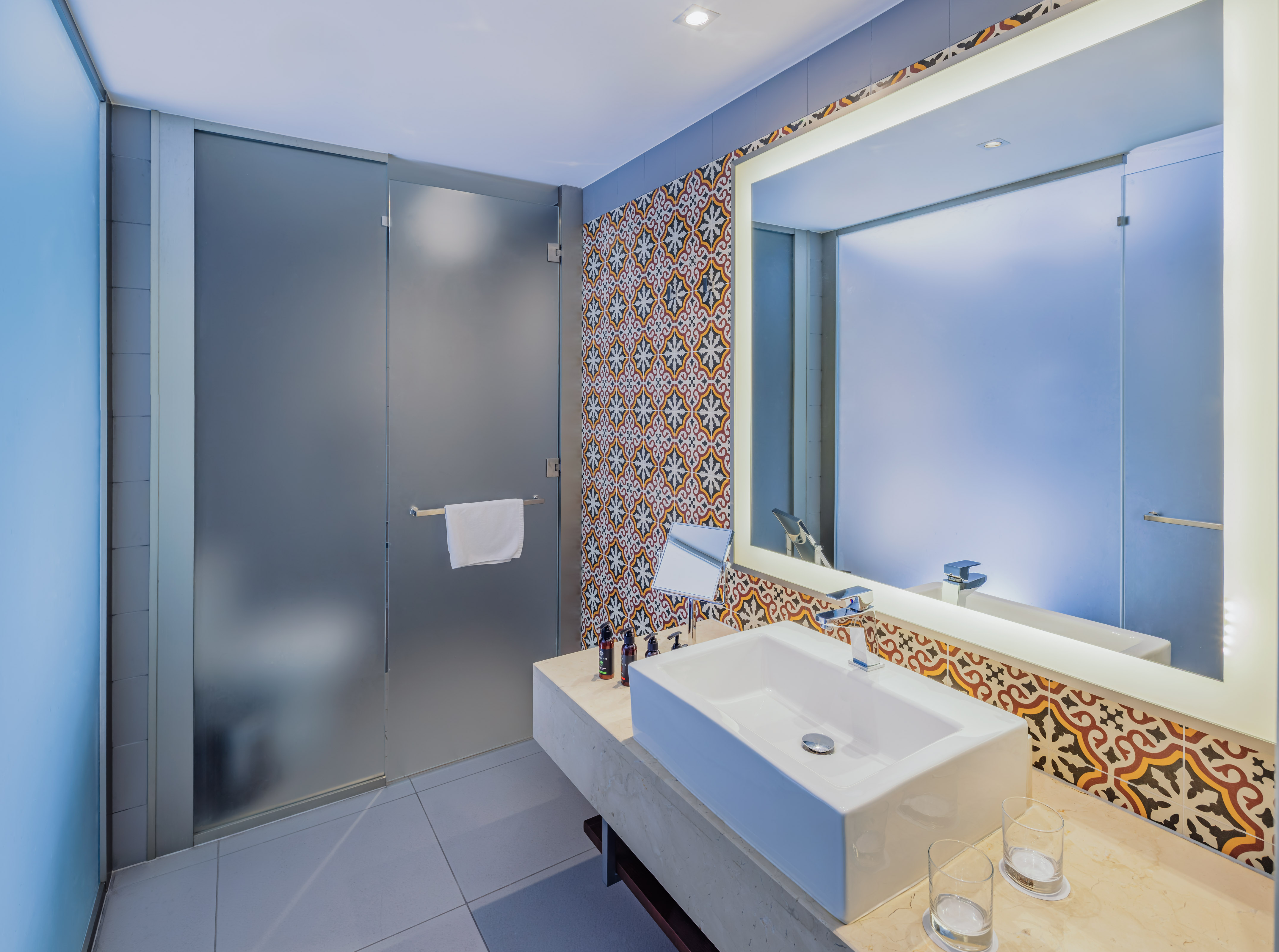 a bathroom with a sink and mirror