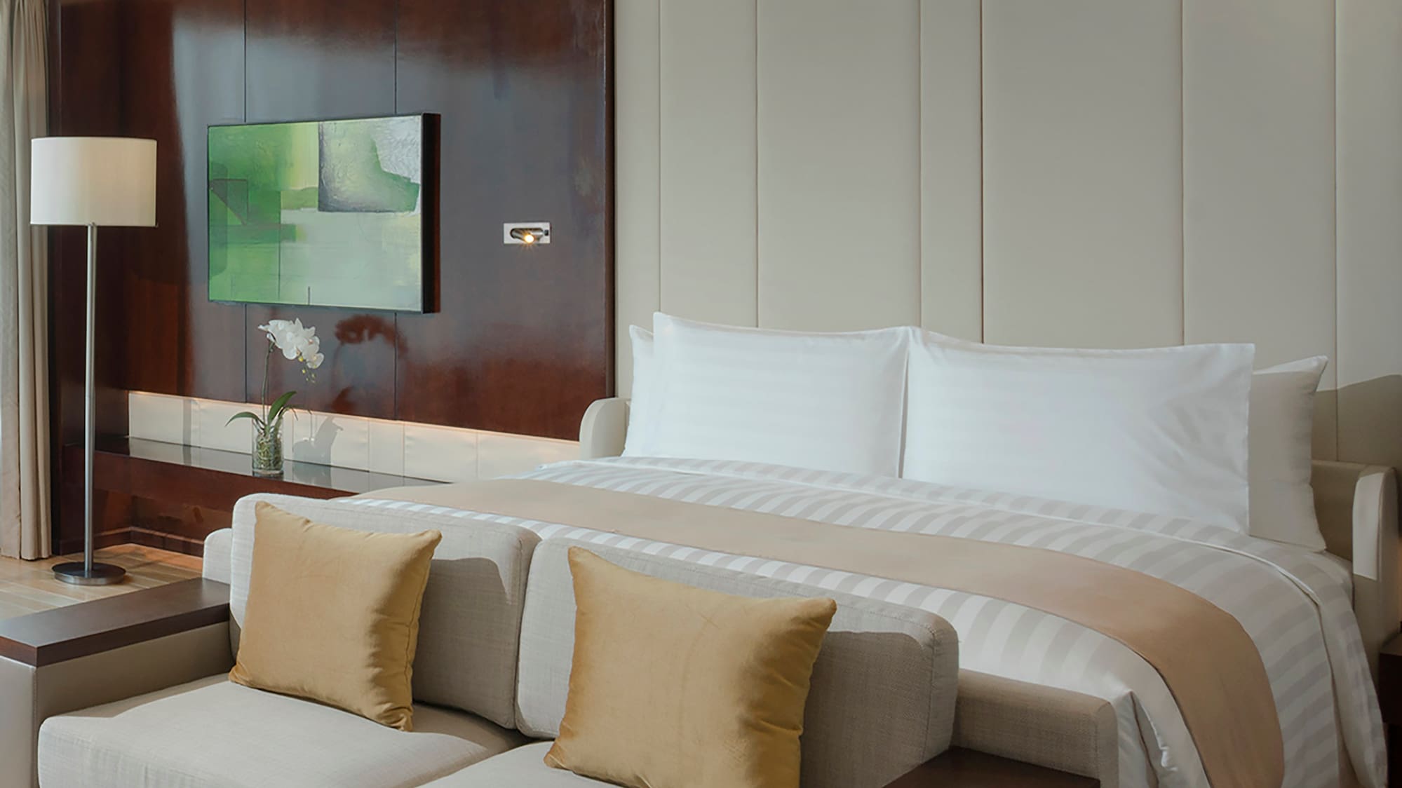 a bed with a tv in a room