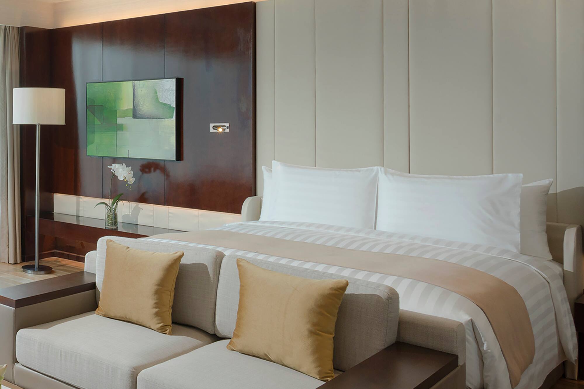 a bed with a tv in a room