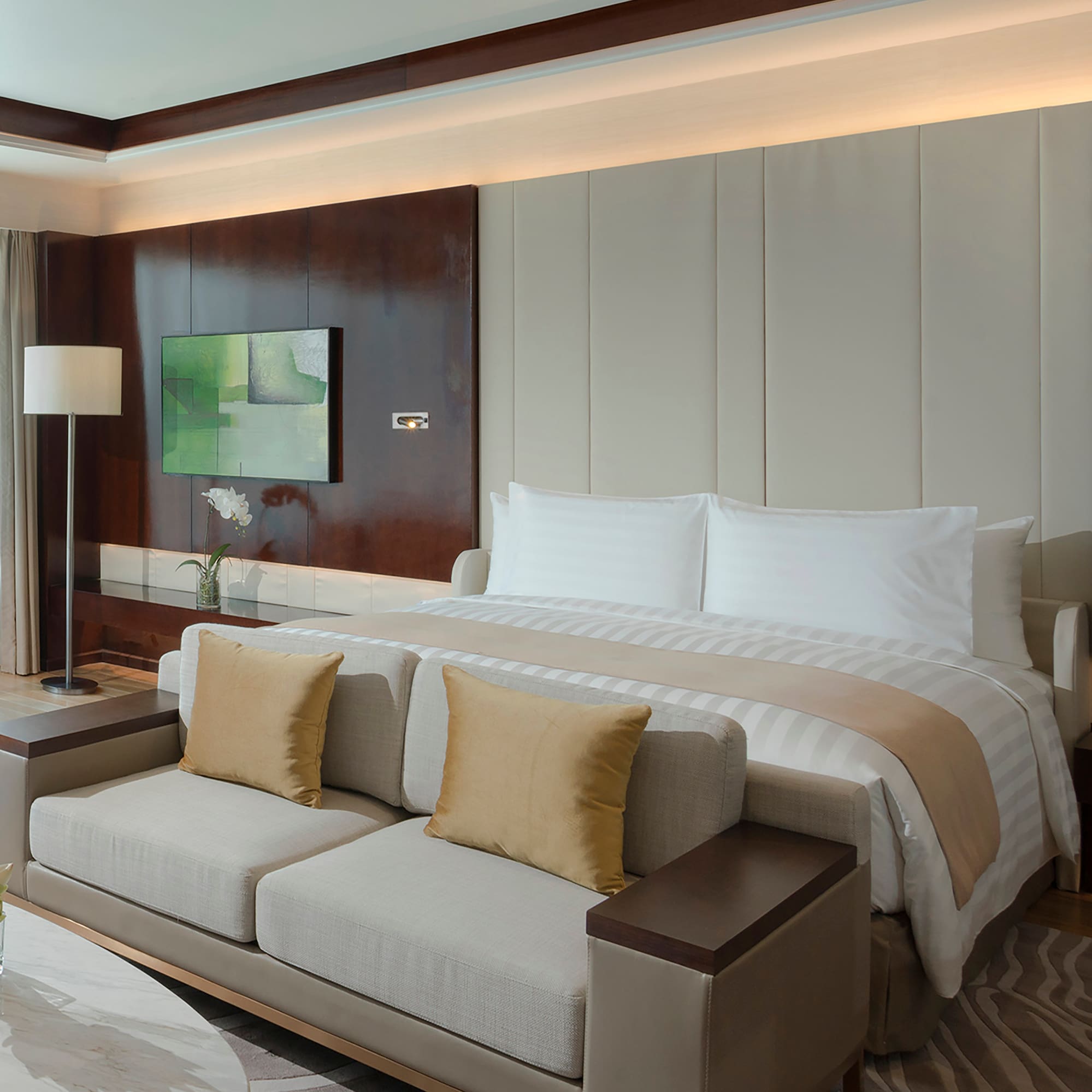 a bed with a tv in a room