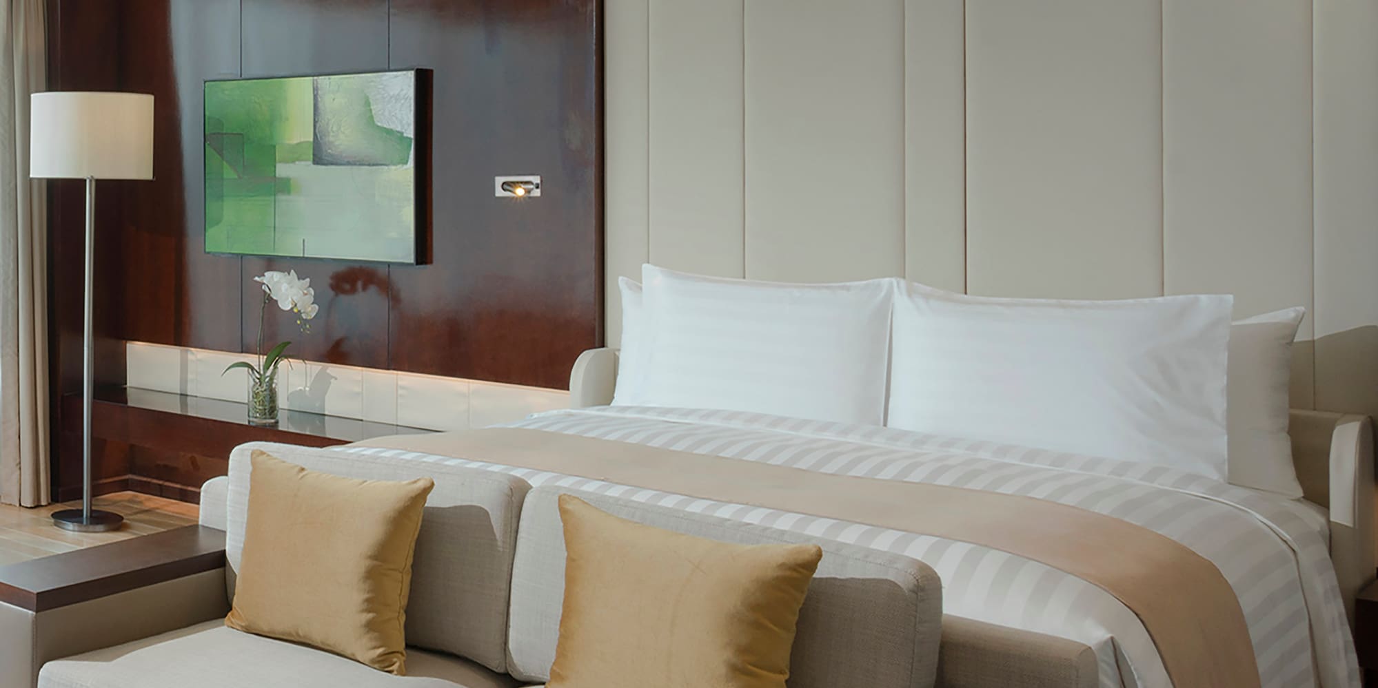a bed with a tv in a room