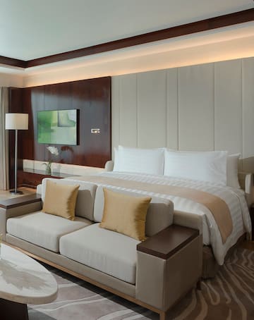 a bed with a tv in a room