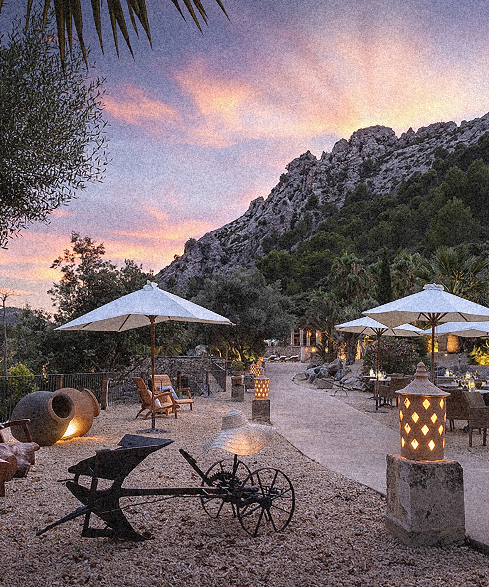 a patio area with umbrellas and chairs