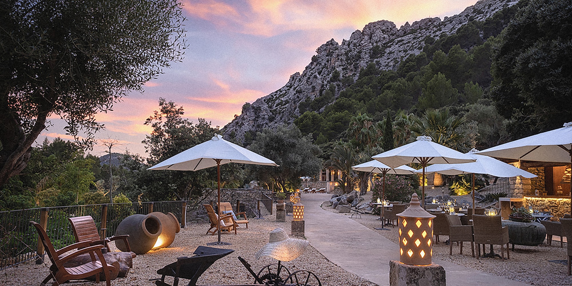 a patio area with umbrellas and chairs