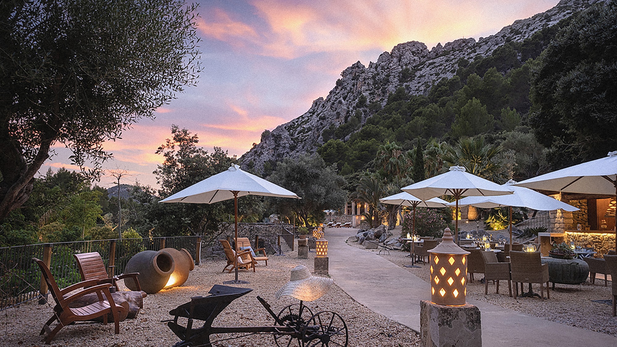 a patio area with umbrellas and chairs