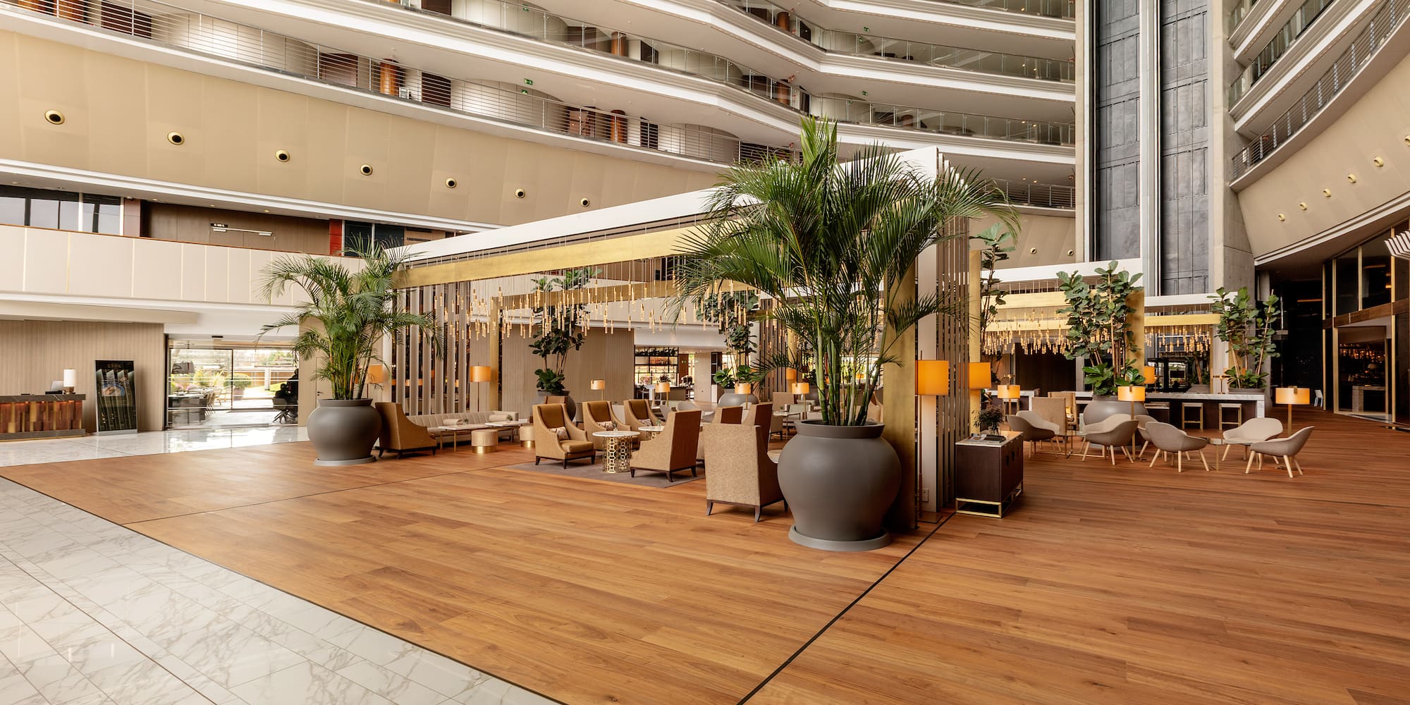 a large room with plants in pots