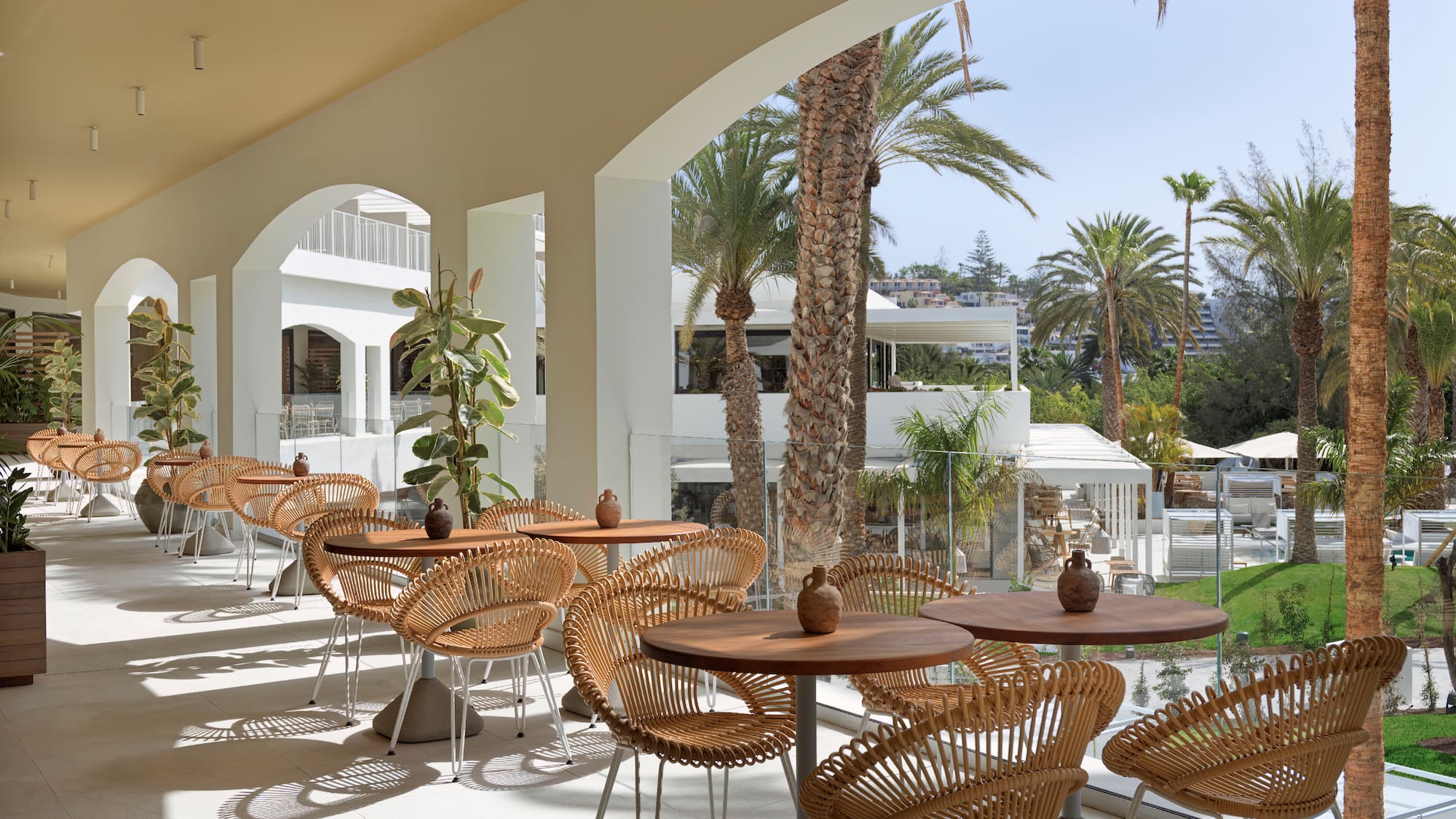 a patio with tables and chairs