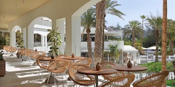 a patio with tables and chairs