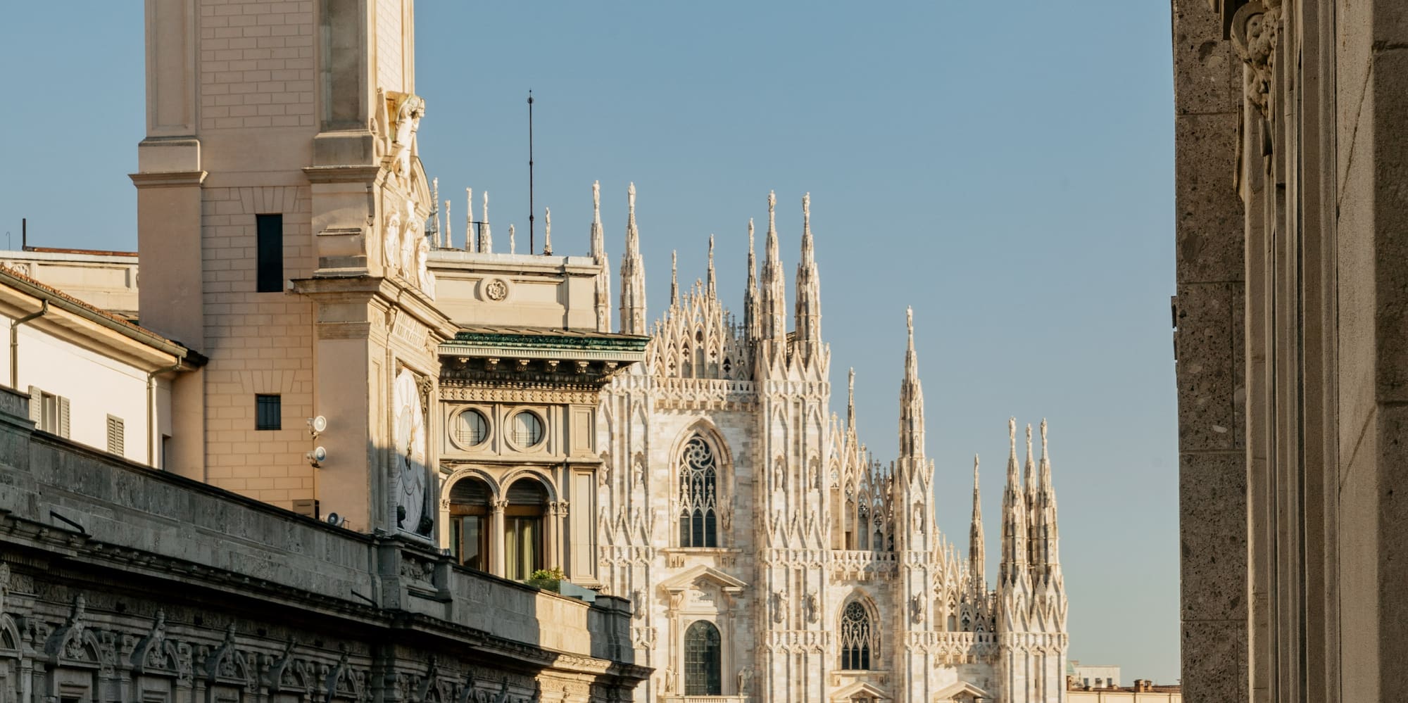 a group of people walking in front of a large building