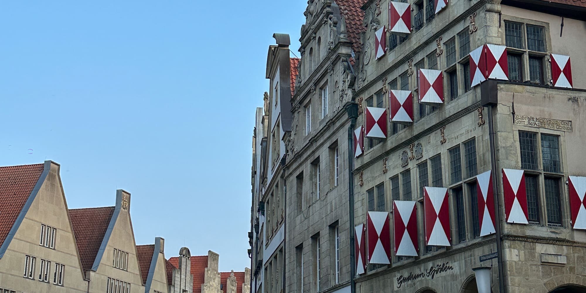 a street with buildings and a street sign