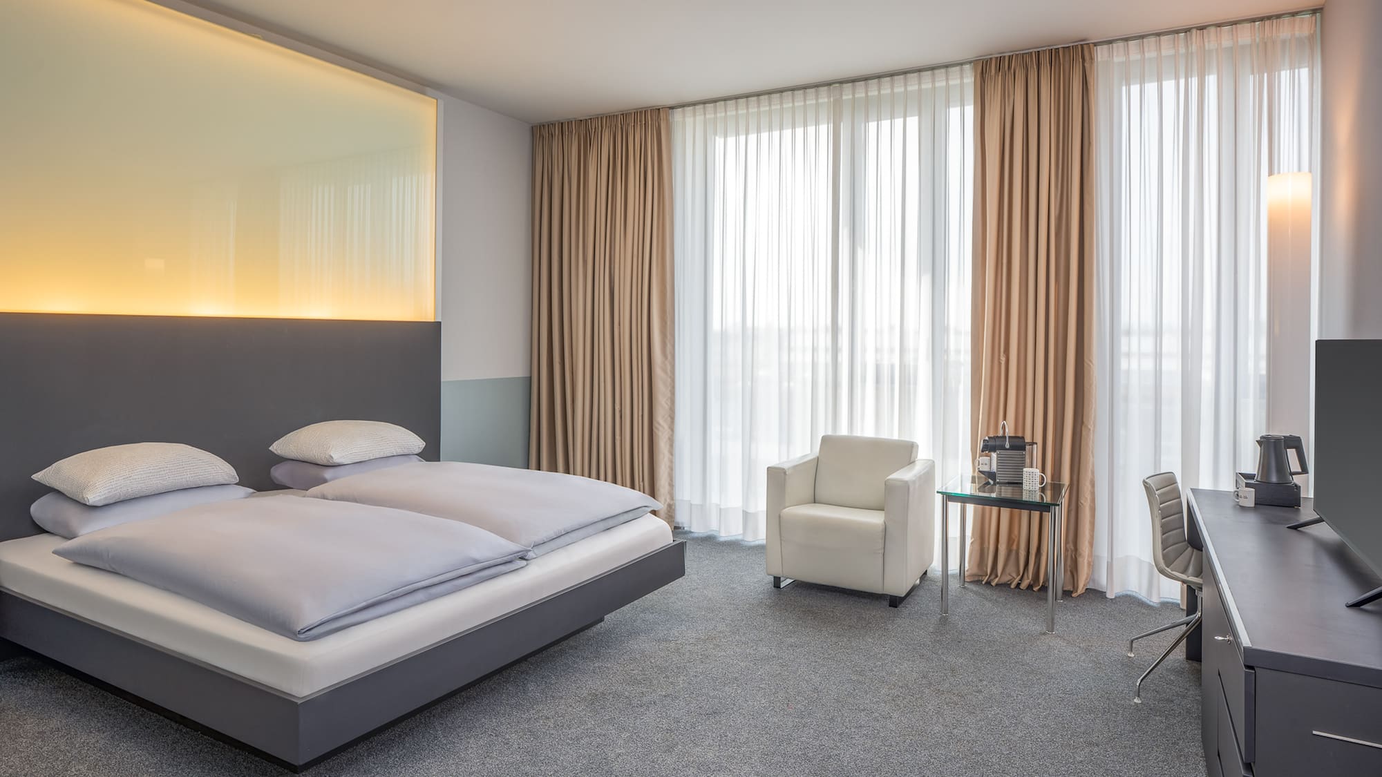 a bedroom with a bed and chair