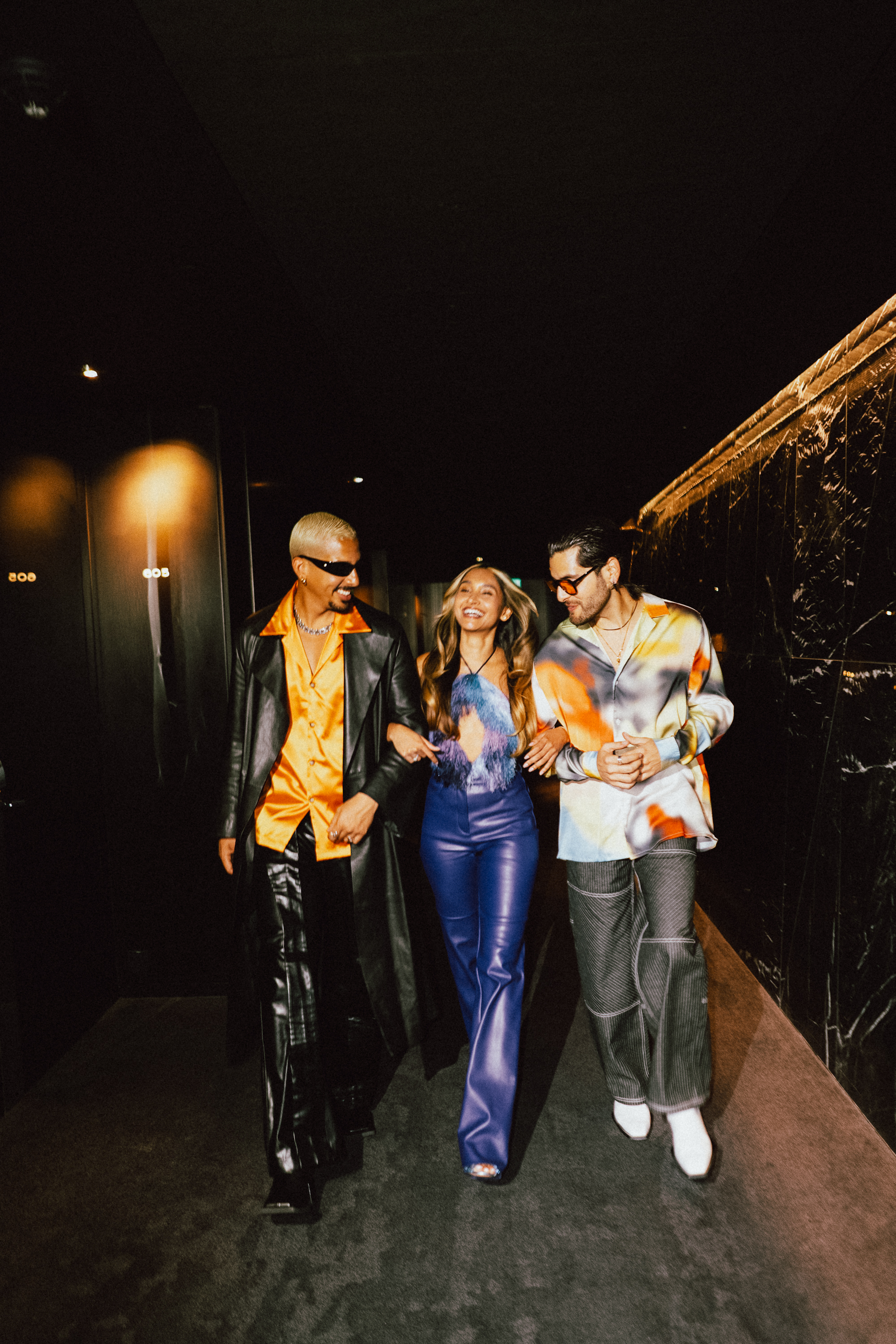 a group of people walking down a walkway