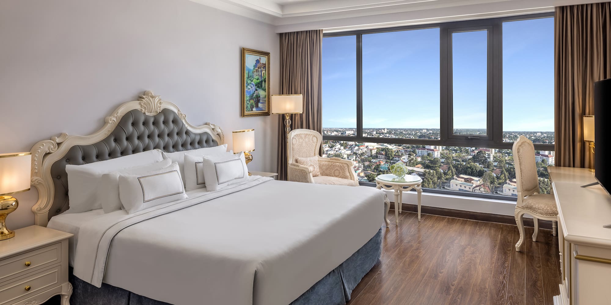 a bedroom with a large window and a large bed