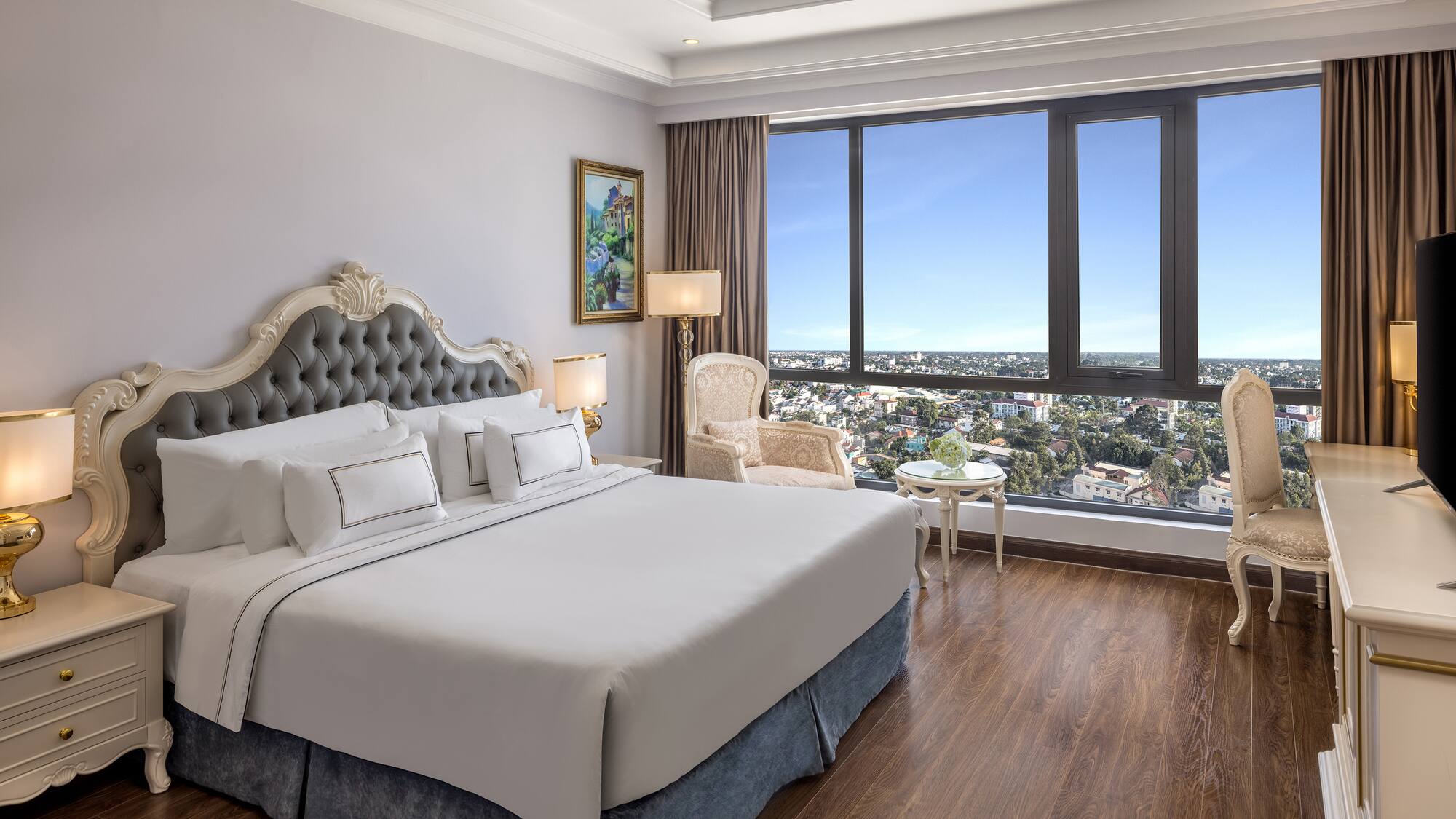 a bedroom with a large window and a large bed