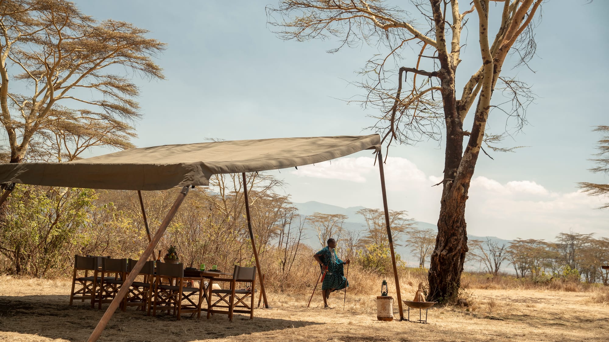 a woman standing under a tent