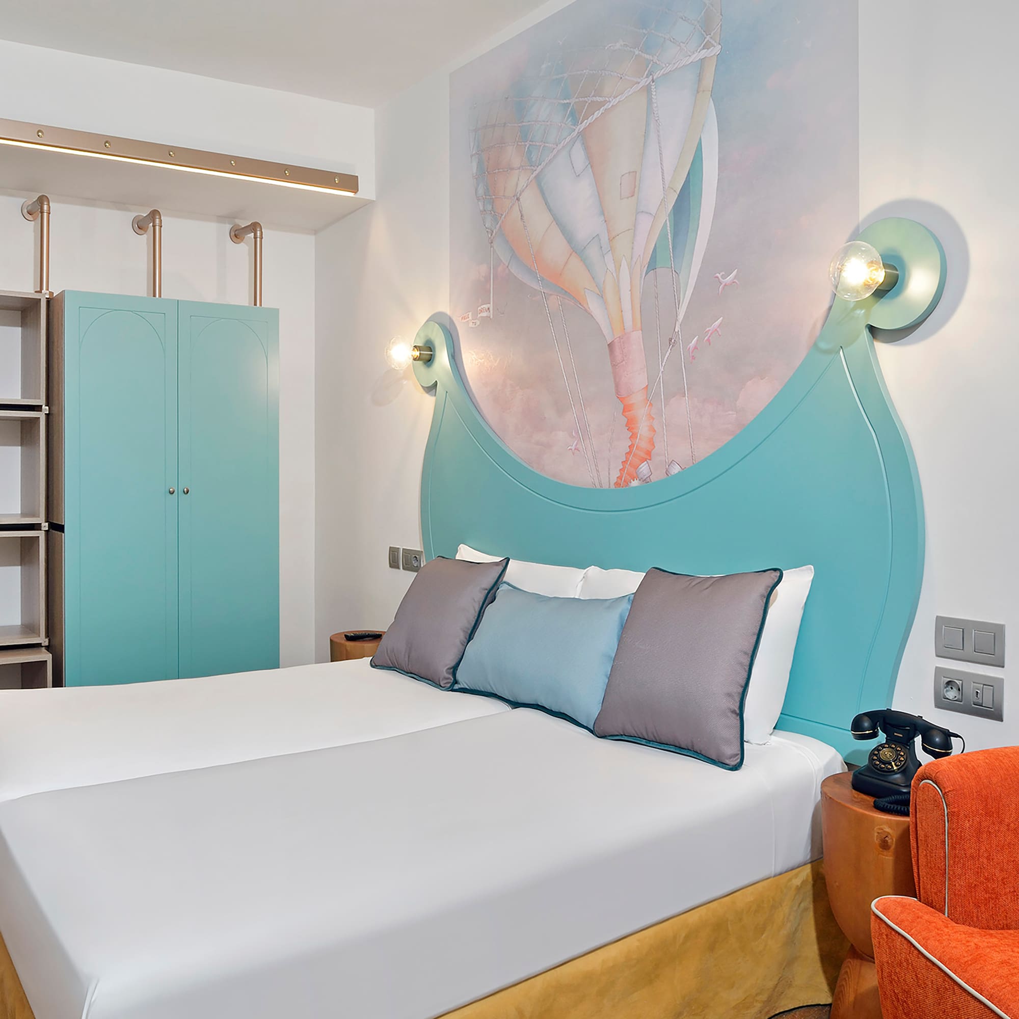 a bed with a picture on the wall