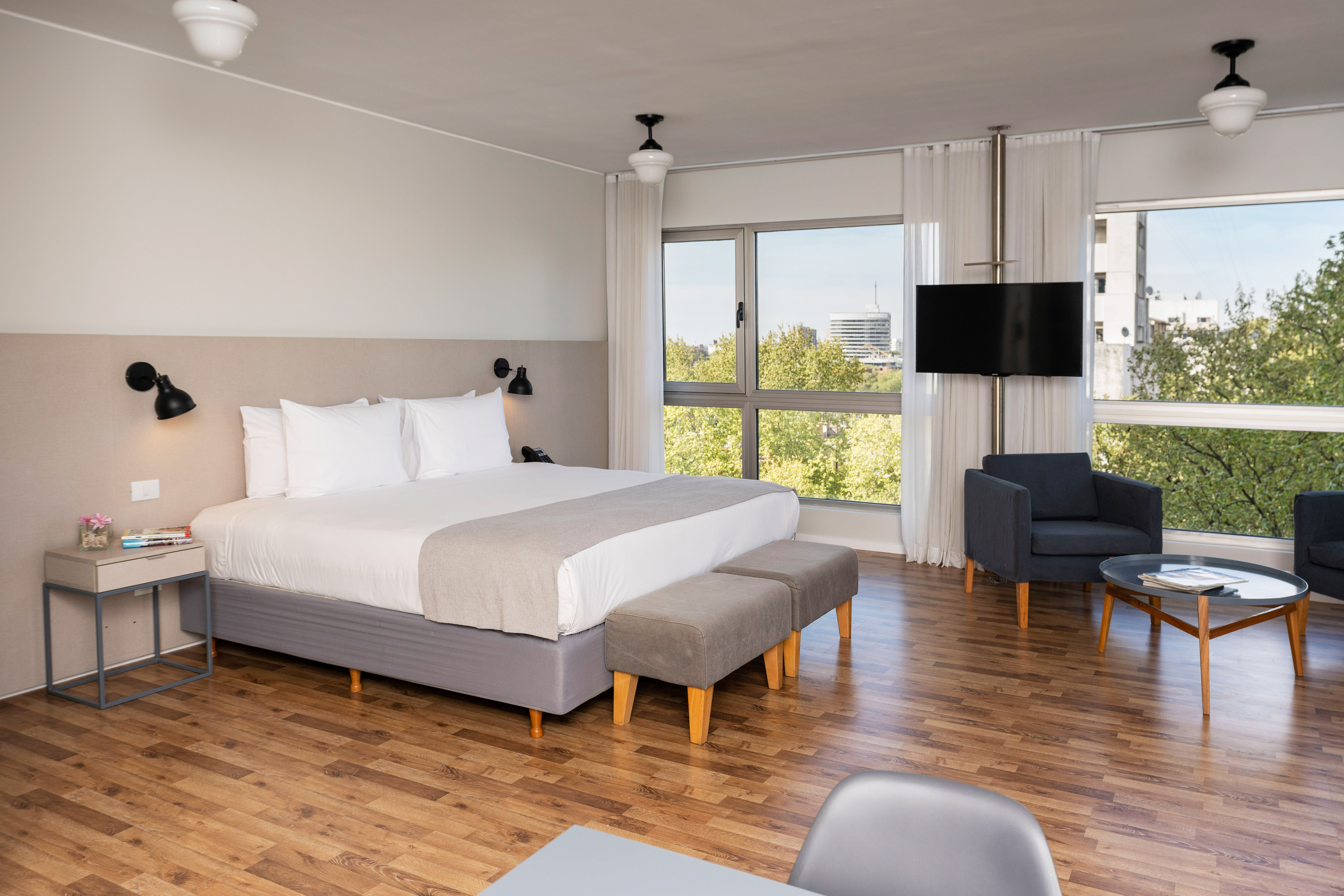 a bedroom with a bed and a chair