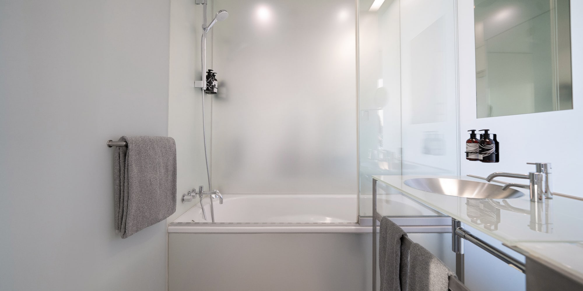 a bathroom with a bathtub and sink