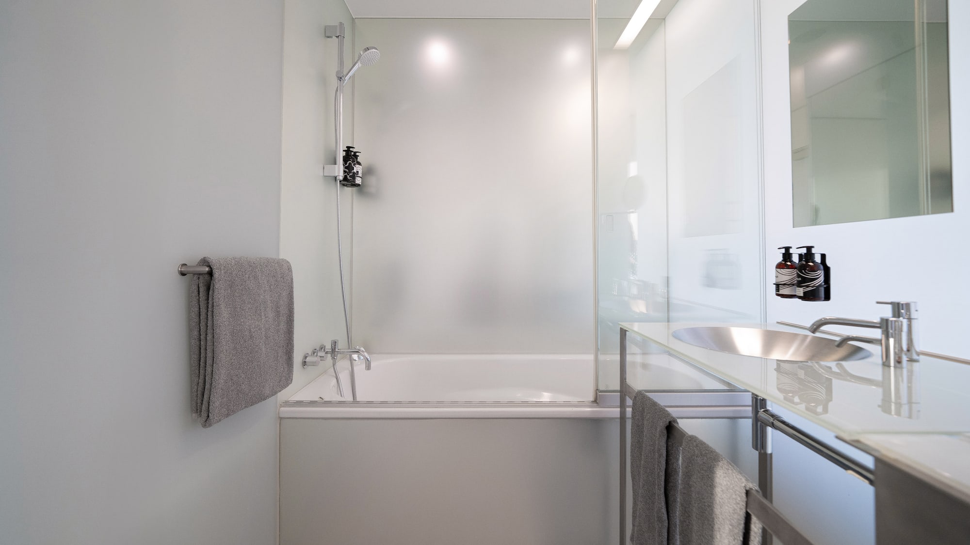a bathroom with a bathtub and sink