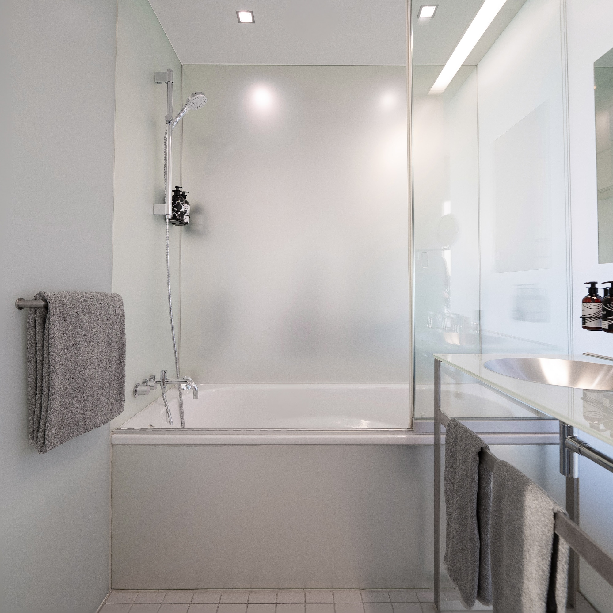 a bathroom with a bathtub and sink