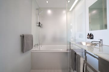 a bathroom with a bathtub and sink