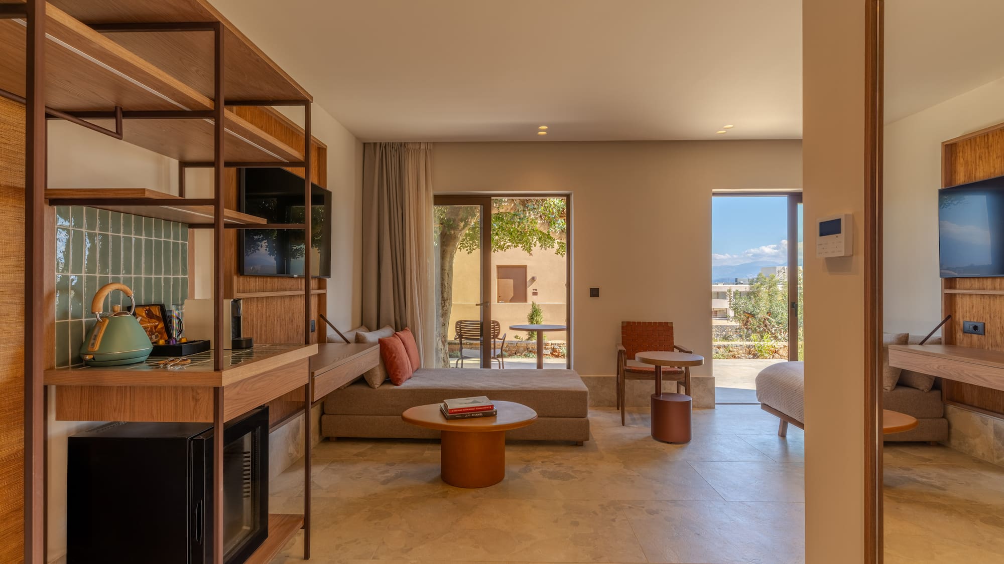 a room with a bed and a television