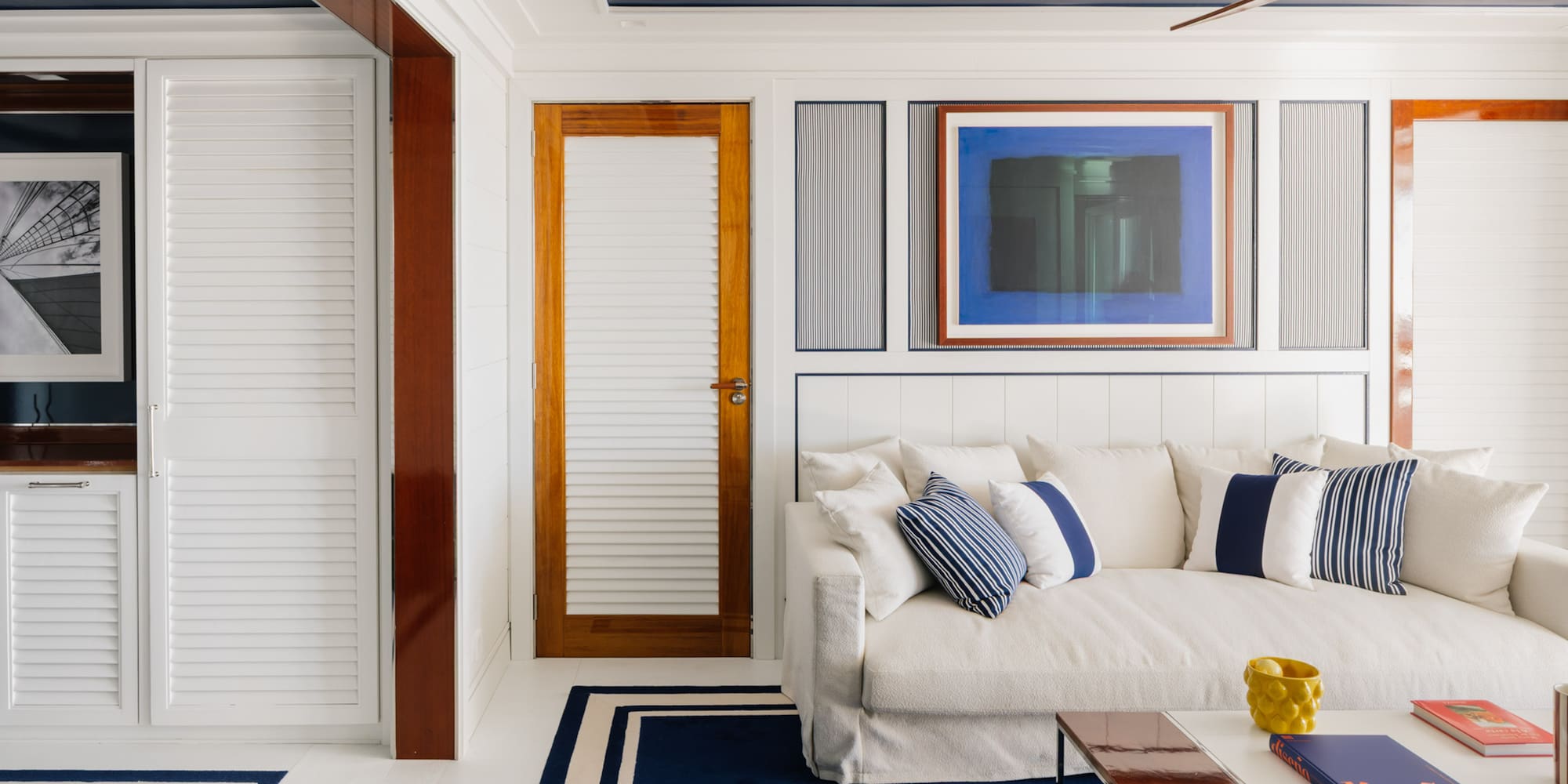 a white couch with pillows in a room