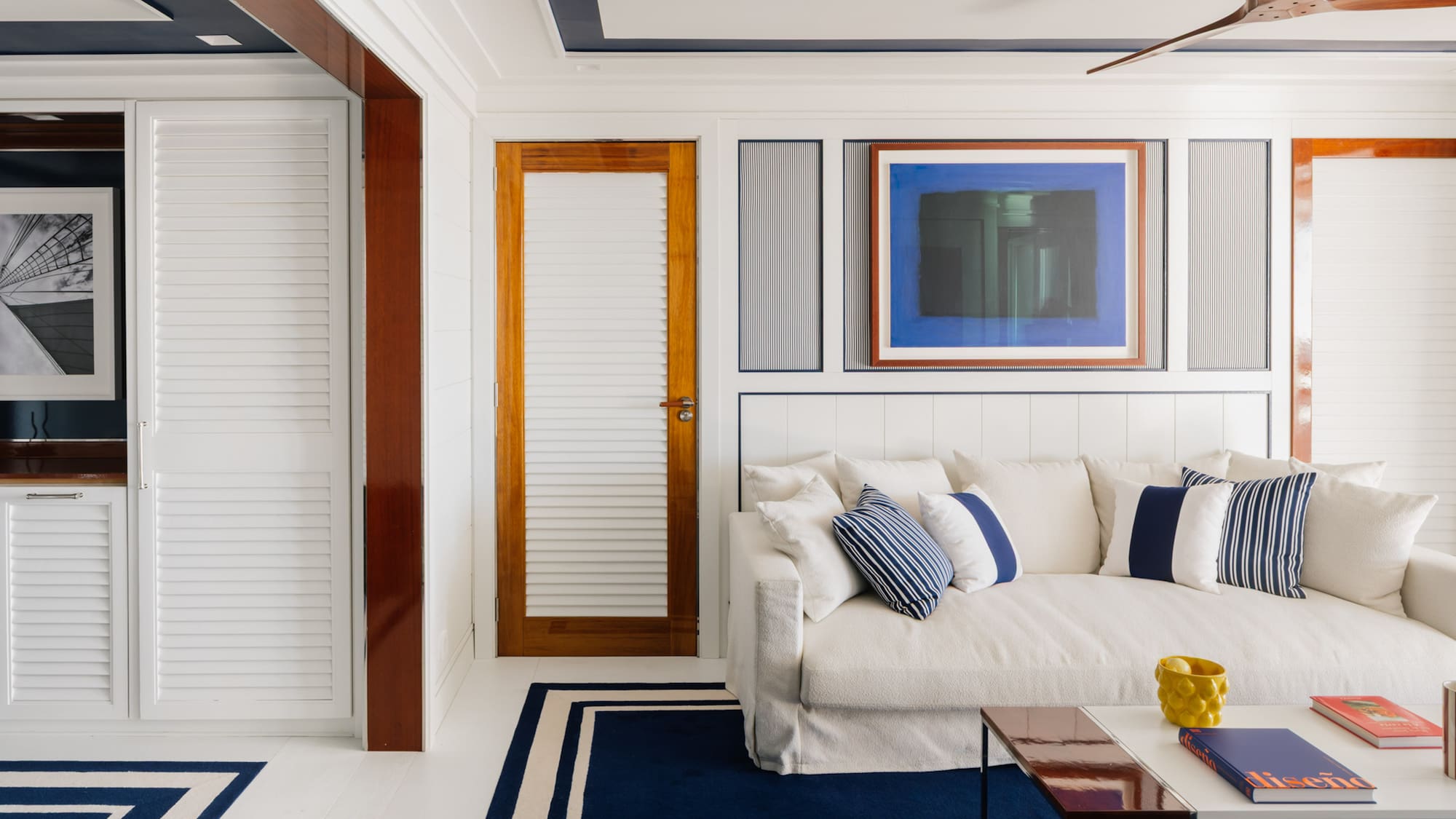 a white couch with pillows in a room