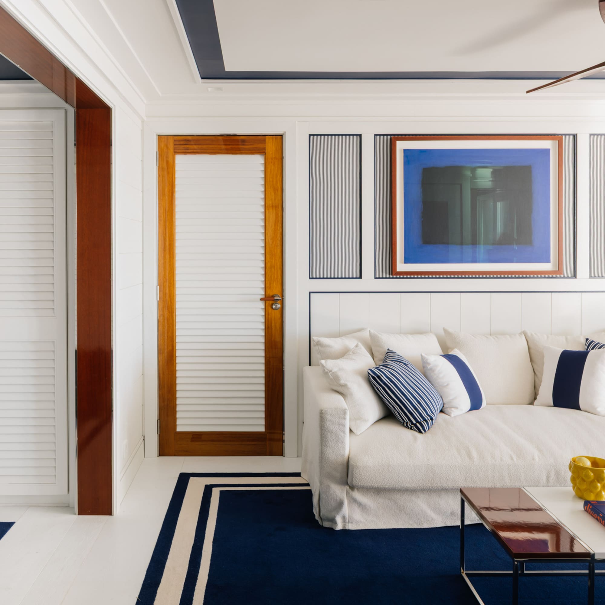 a white couch with pillows in a room