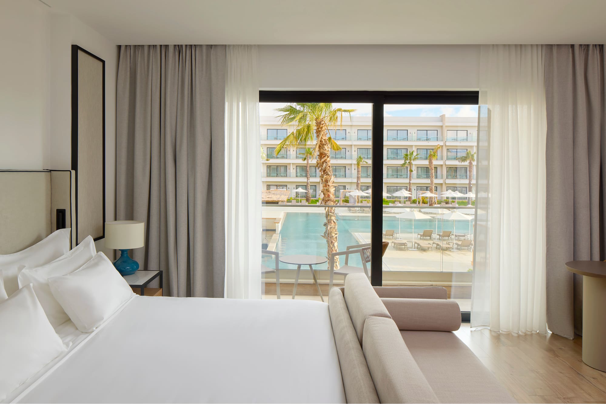 a bed and couch in a hotel room