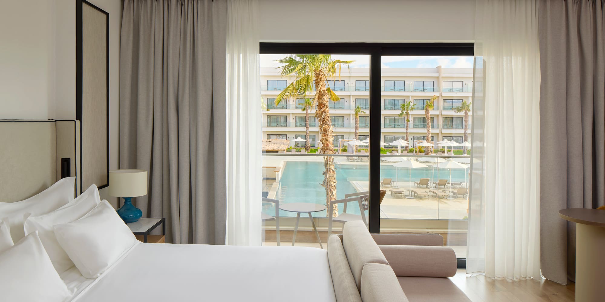 a bed and couch in a hotel room