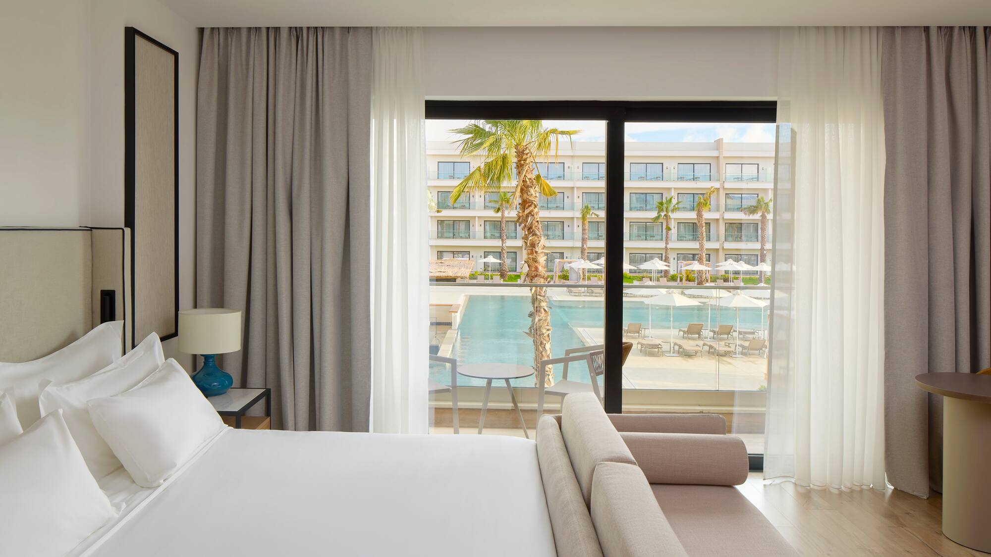 a bed and couch in a hotel room