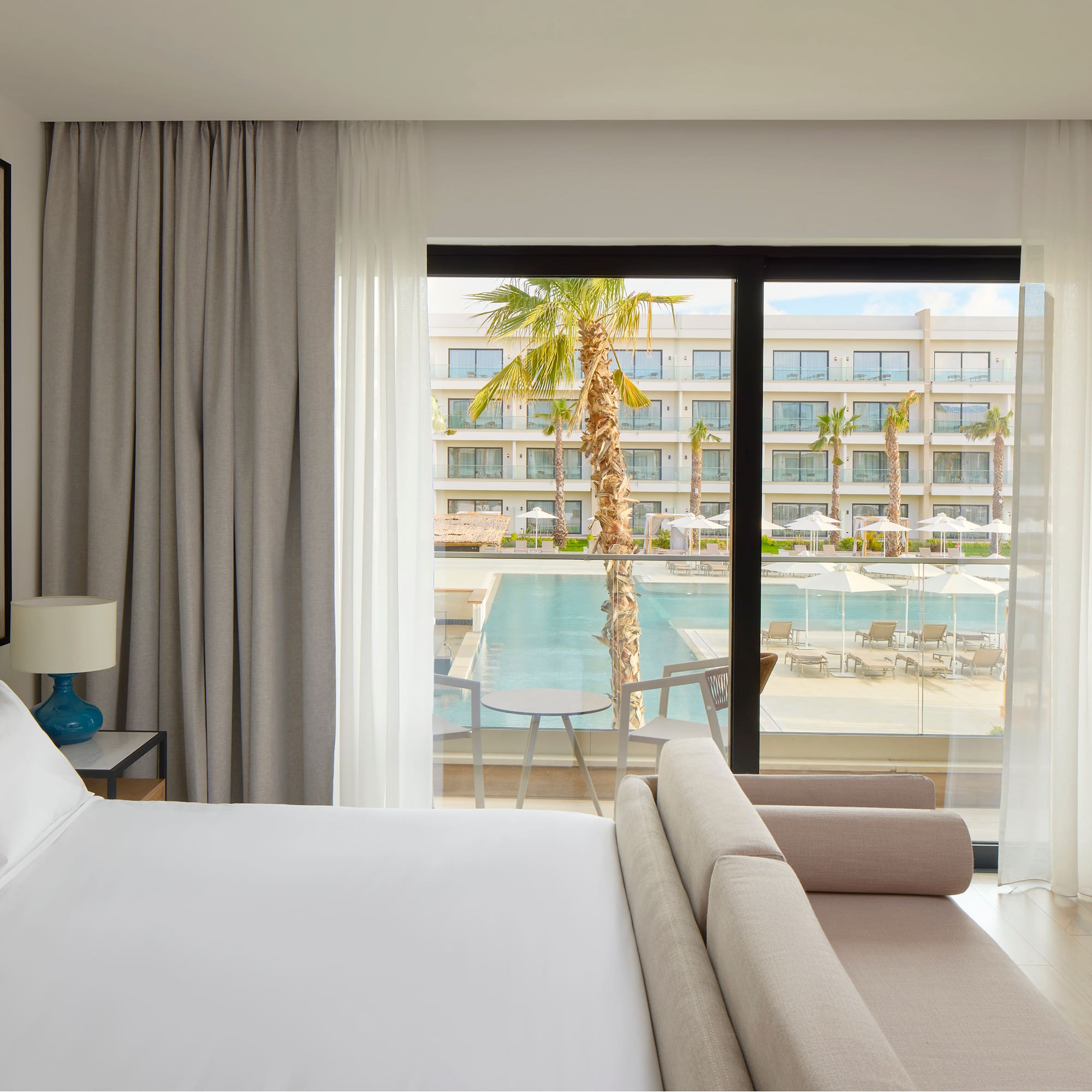 a bed and couch in a hotel room