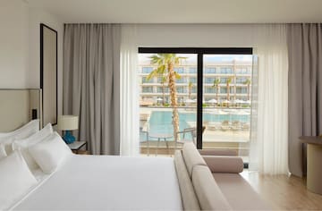 a bed and couch in a hotel room
