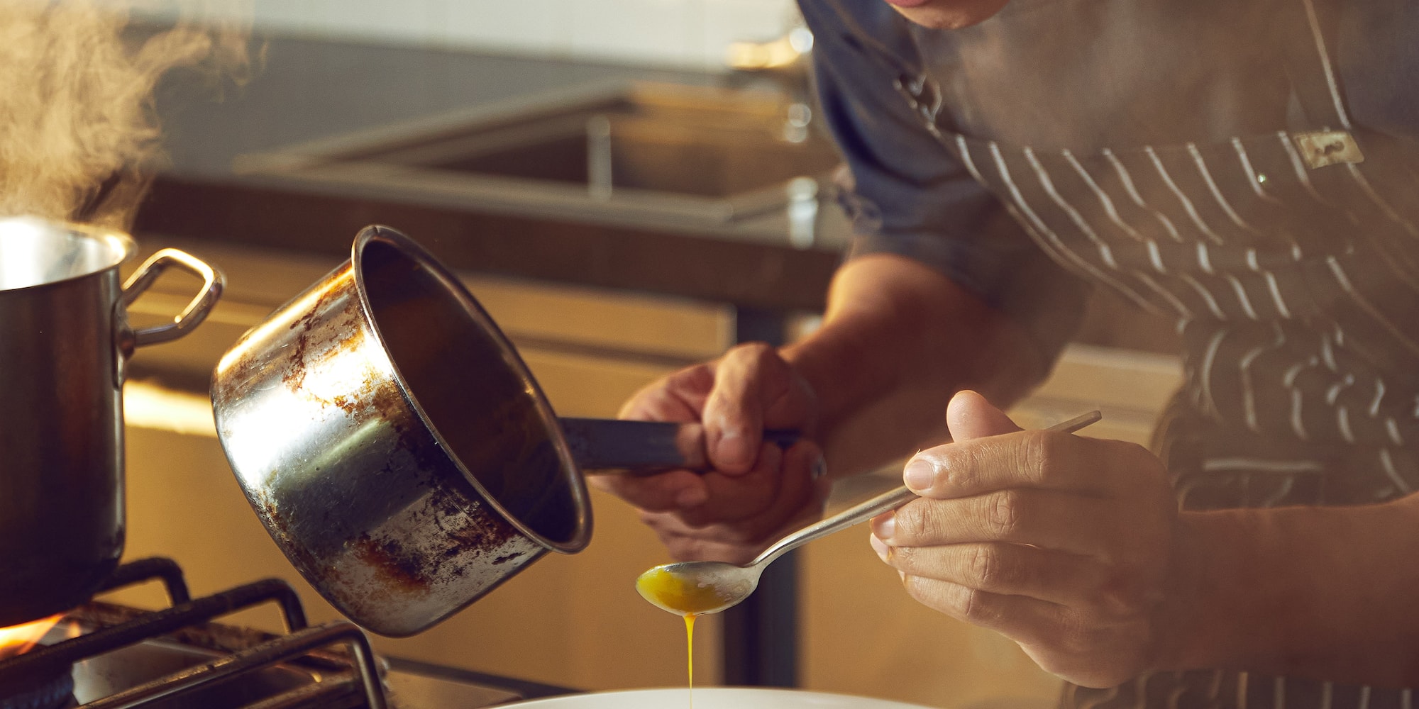 a man cooking in a kitchen