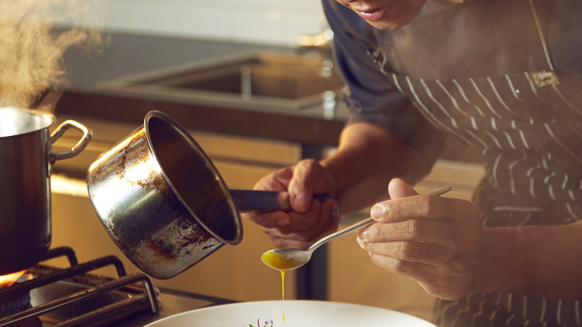a man cooking in a kitchen