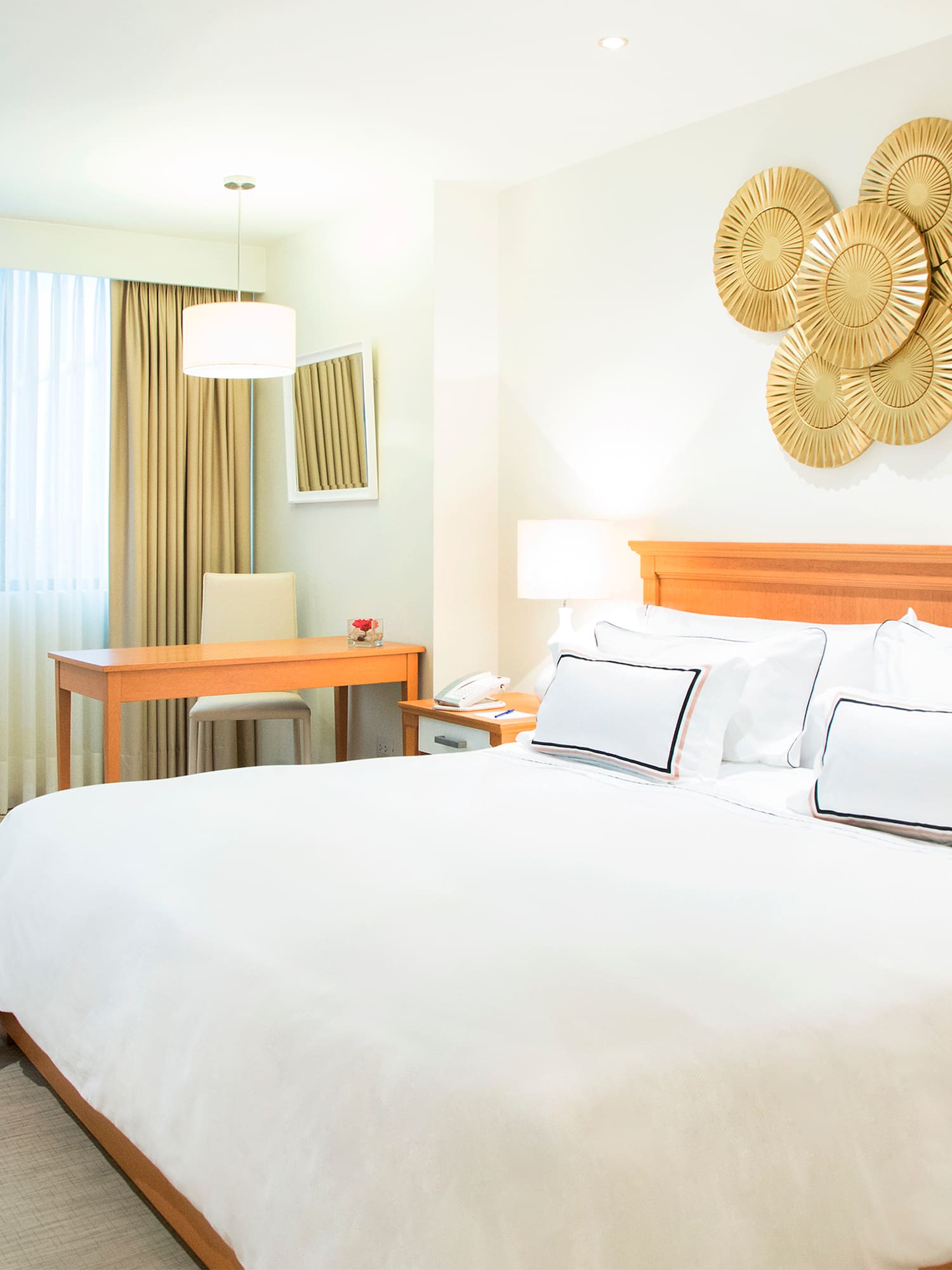 a bedroom with a bed and a desk