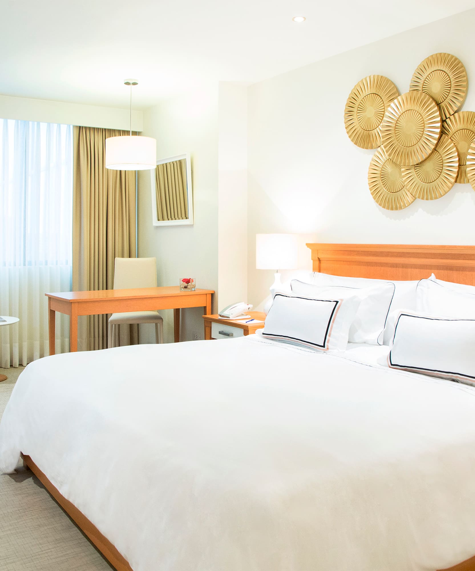 a bedroom with a bed and a desk