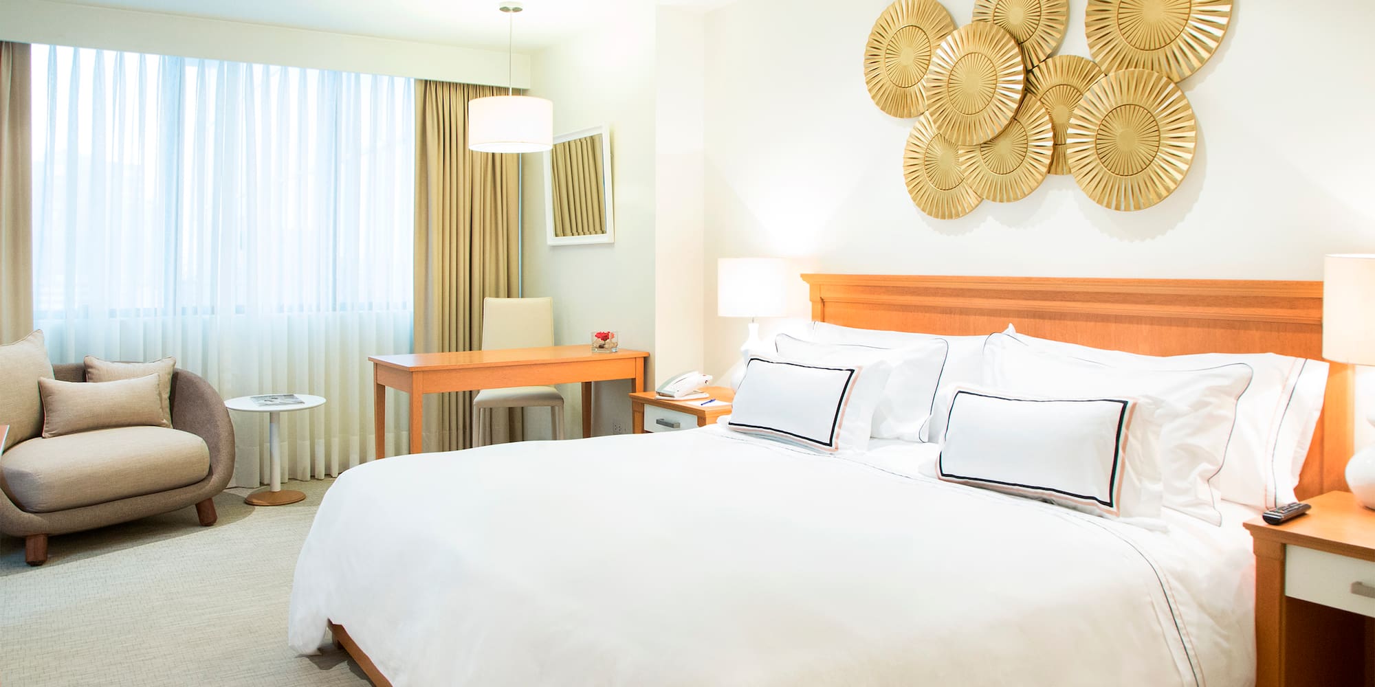 a bedroom with a bed and a desk