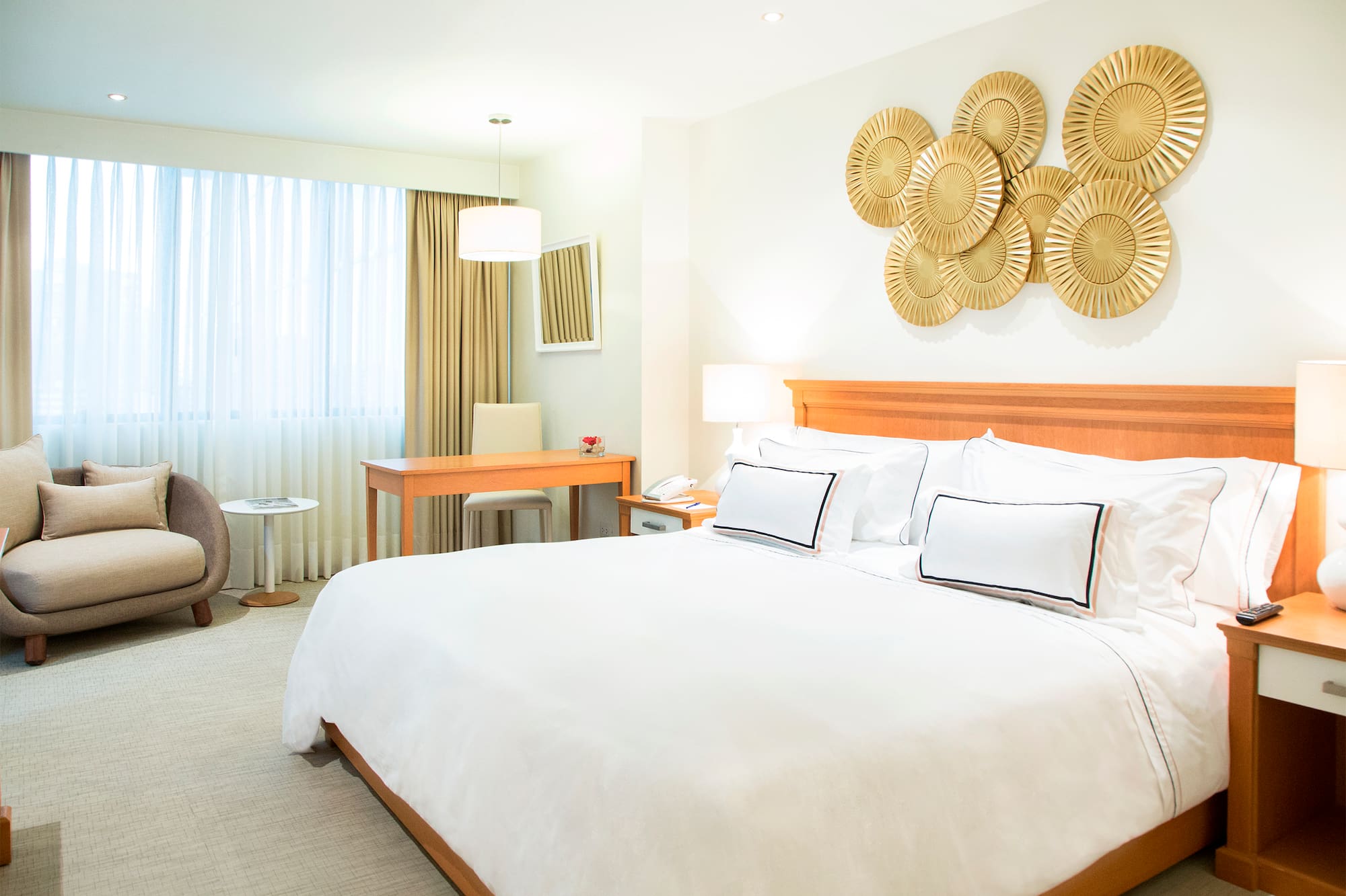 a bedroom with a bed and a desk