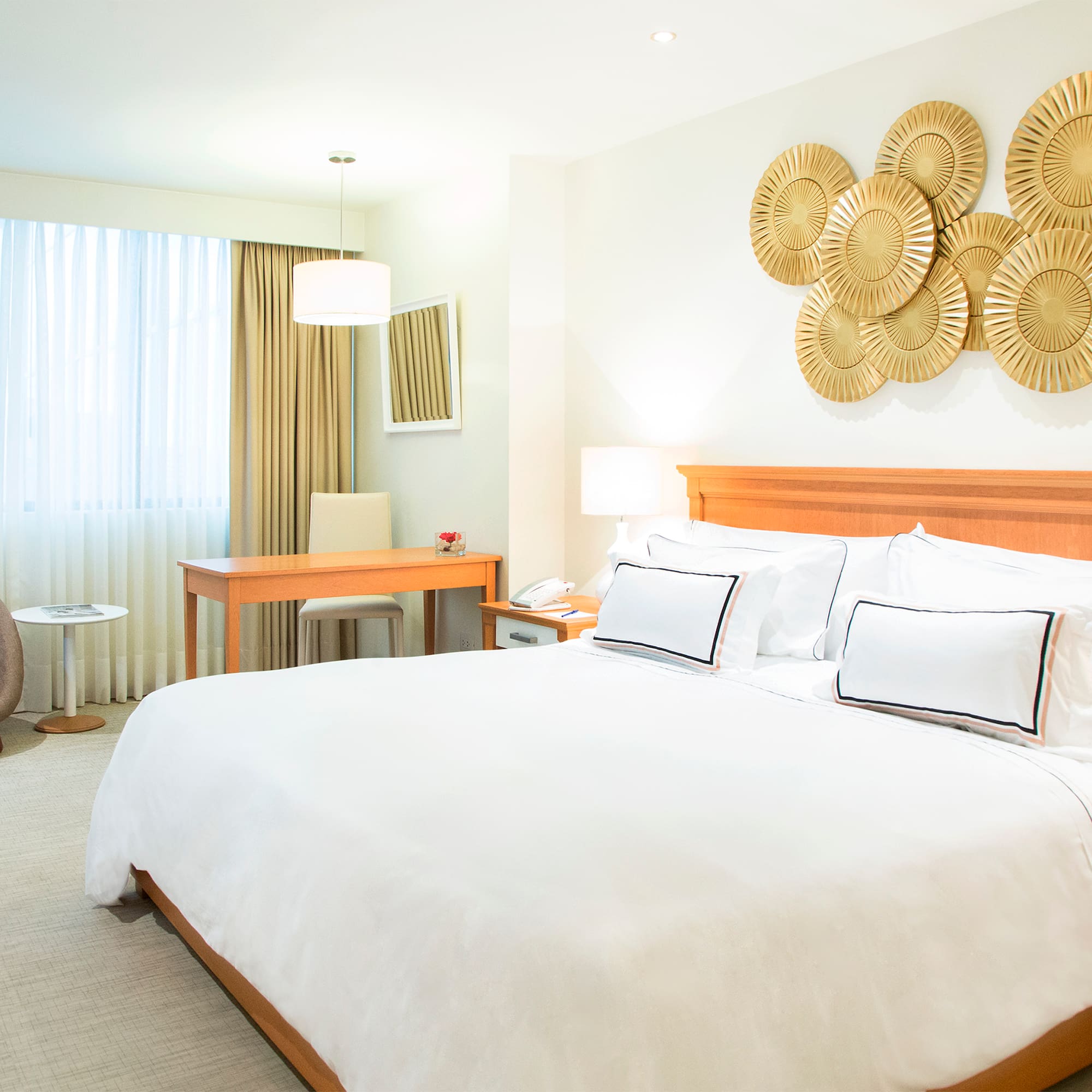 a bedroom with a bed and a desk