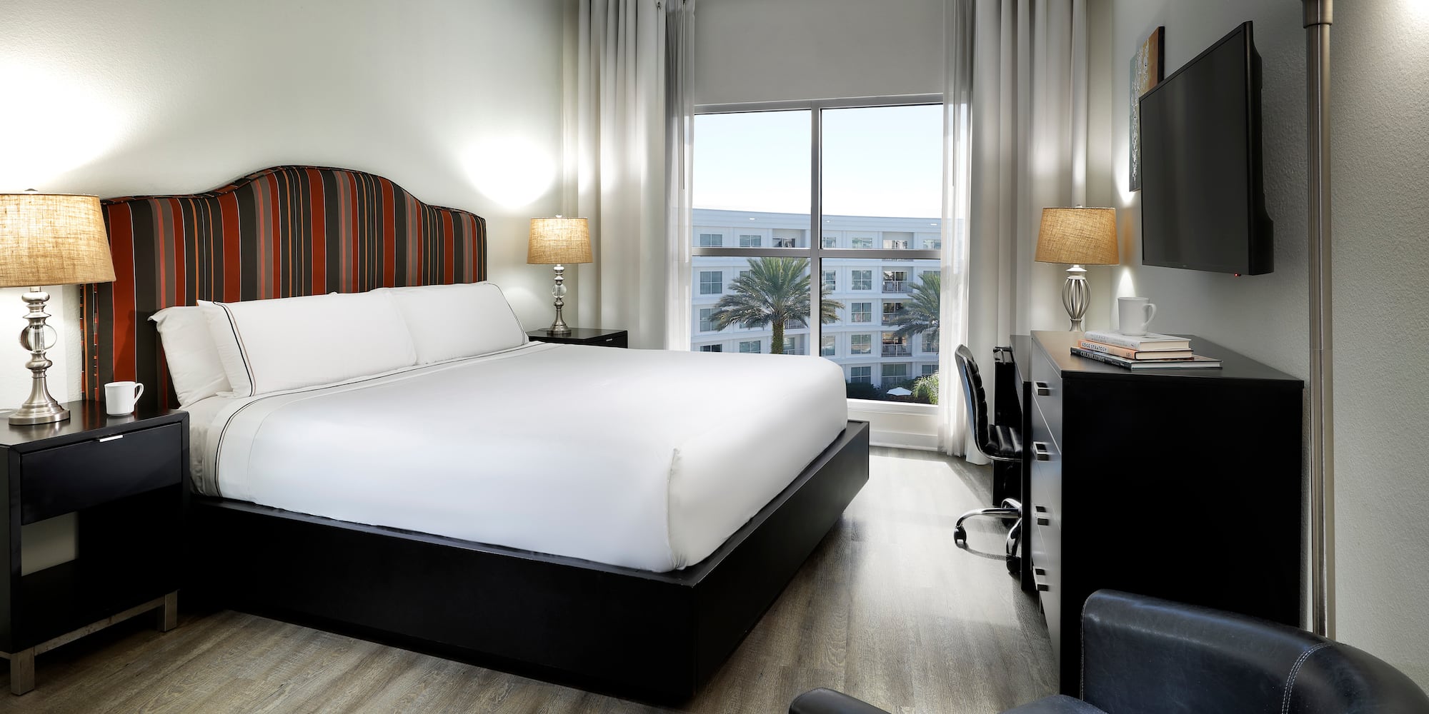 a room with a bed and a tv