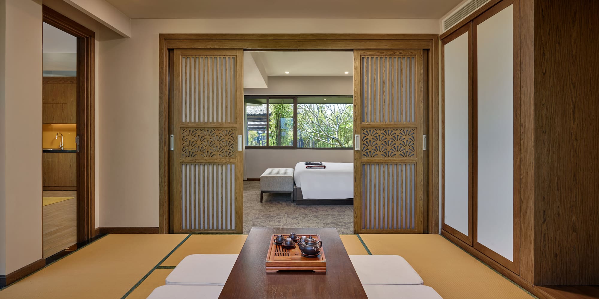 a room with a table and a bed