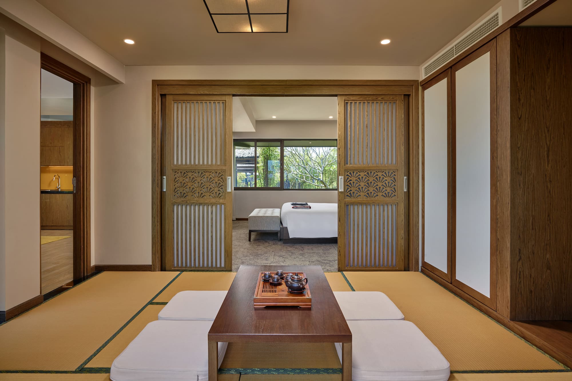 a room with a table and a bed